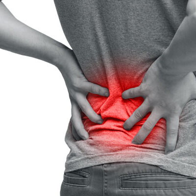 Woman experiencing lower back pain as a result of sciatica