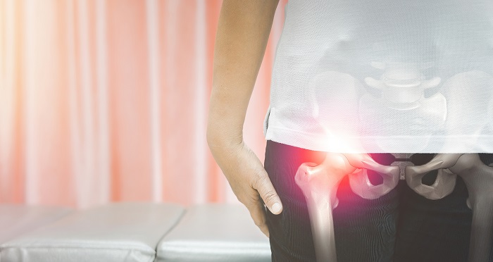 Close up image of woman suffering from hip pain